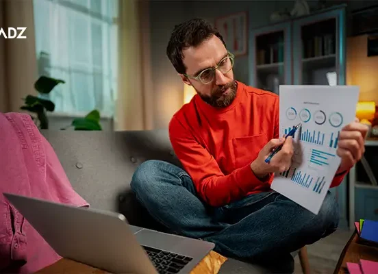 Man reviewing website analytics report showing Bounce Rate metrics on laptop screen.
