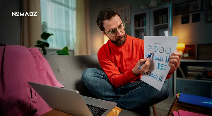 Man reviewing website analytics report showing Bounce Rate metrics on laptop screen.